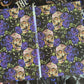 Endpaper design with skull and floral pattern on black background